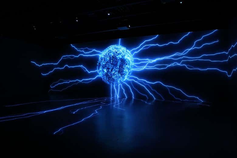 Visit an exhibition of large holograms with lights